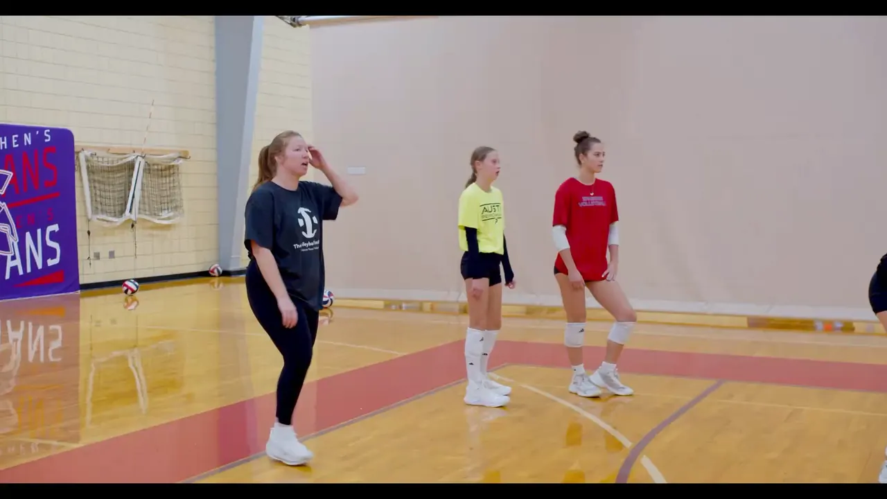 Kelsey Campeau, a TVI Trainer, coaching a small group of athletes on court
