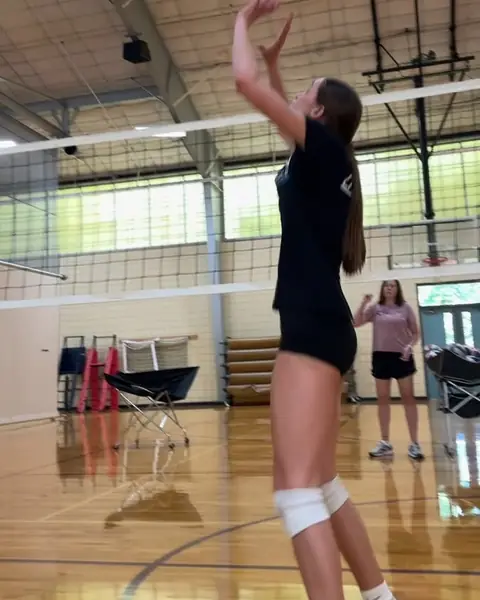 A setter working on footwork with Caitlyn Donahue