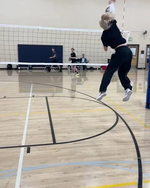An opposite hitter swinging down the line