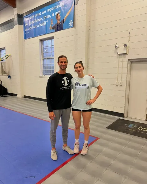 Alex Hurlburt, TVI’s Founder, smiling beside an athlete at a TVI gym in Illinois