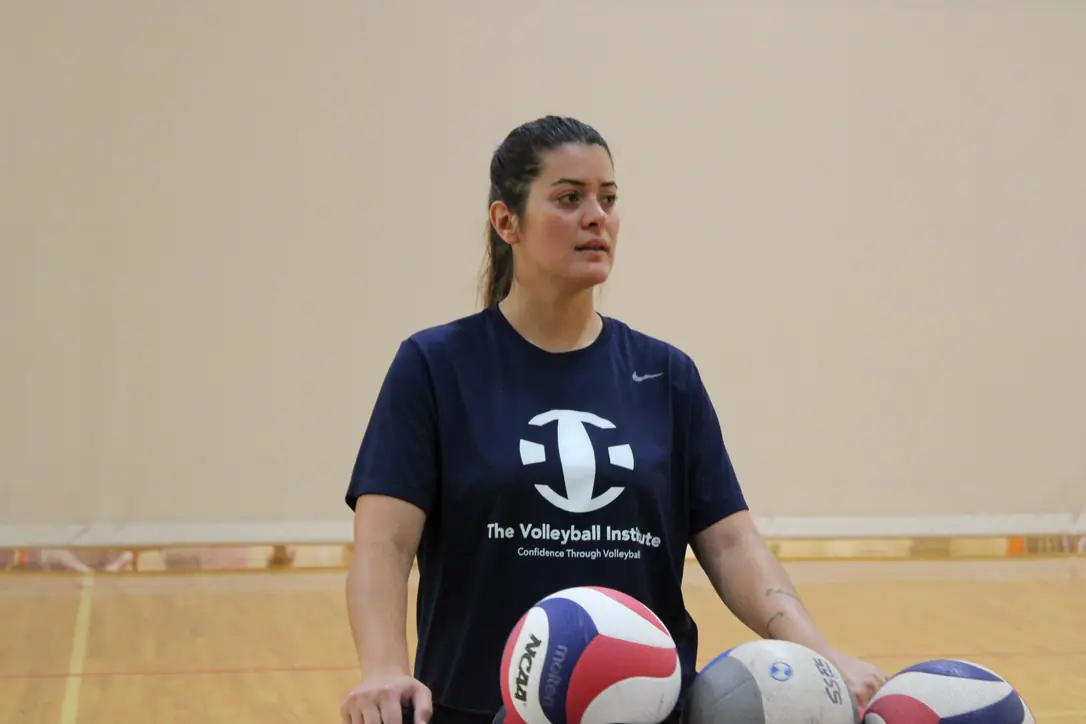 Paulina Prieto Cerame, a TVI Trainer, standing at the ball cart between drills